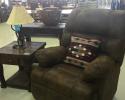 leather recliner and side table with horseshoe lamp 